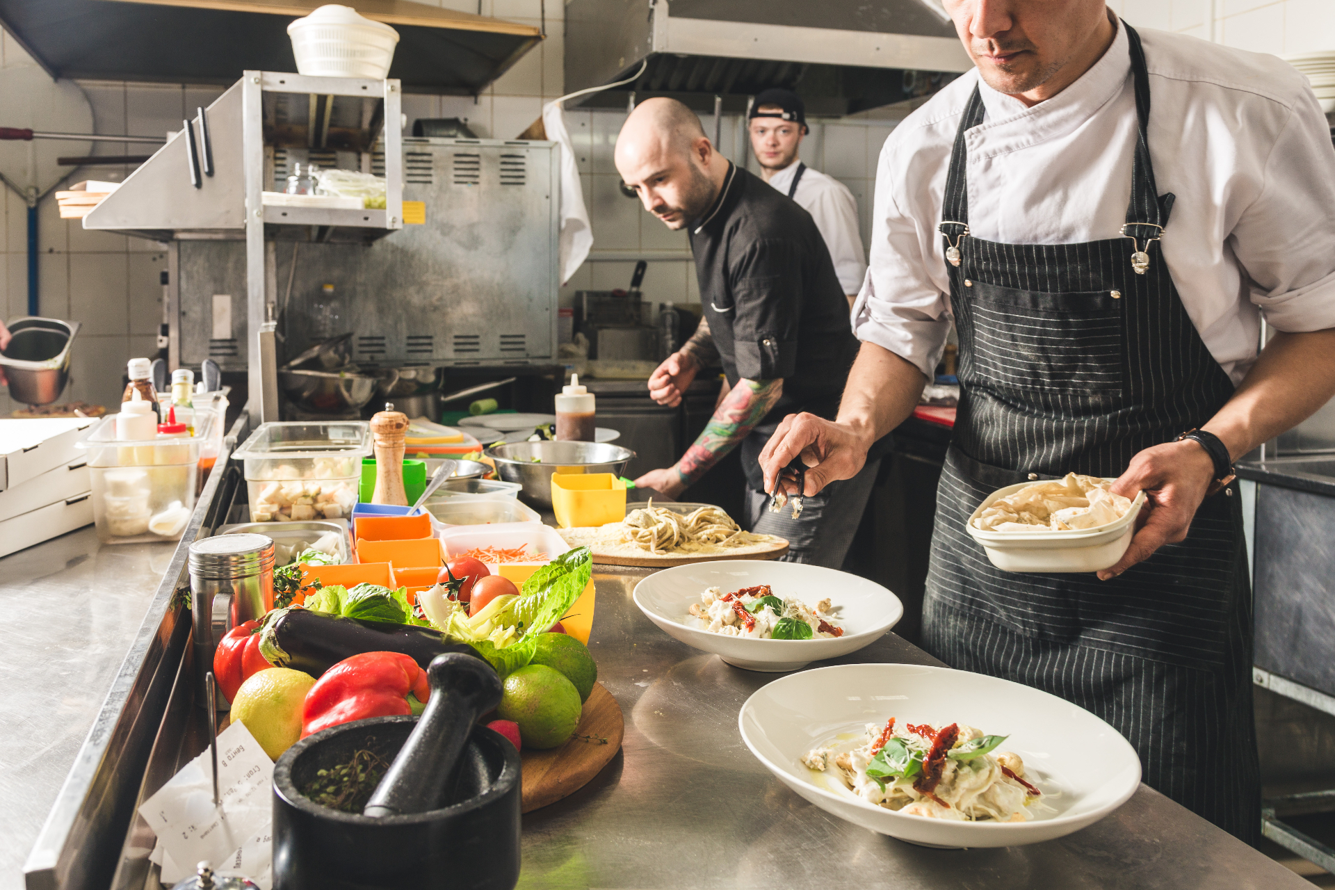 Chefs at work in a professional kitchen